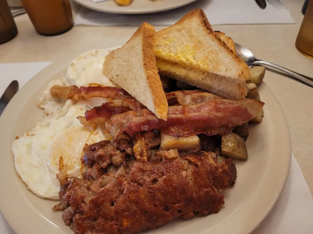 Eggsover Easy Corned Beef Hash Bacon Home Fries White Toast